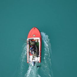 2 fishermen fishing in boat