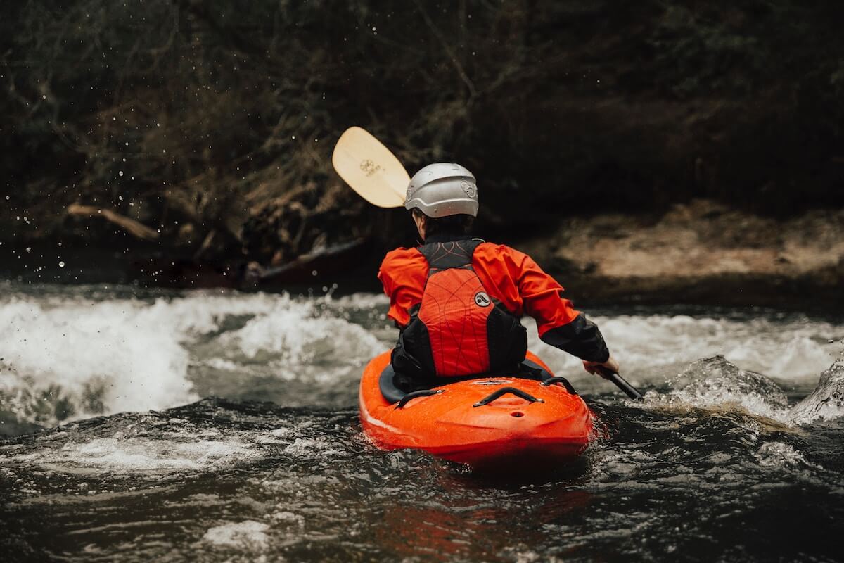 man in kayak in river